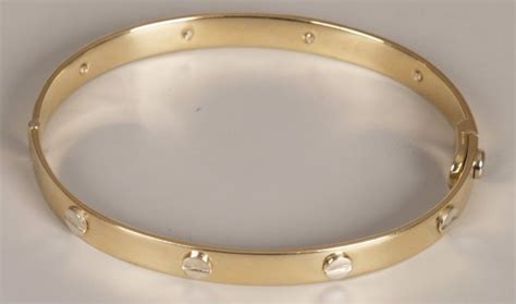 9ct gold cartier style bangle.